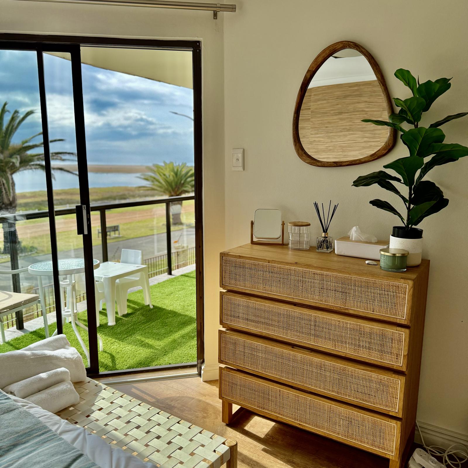 Peak-a-Blue bedroom with lagoon view through sliding doors